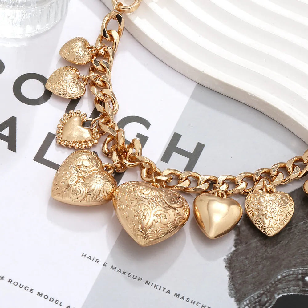 Exaggerated style carved heart pendant necklace for women in gold or white K on a regular chain.
