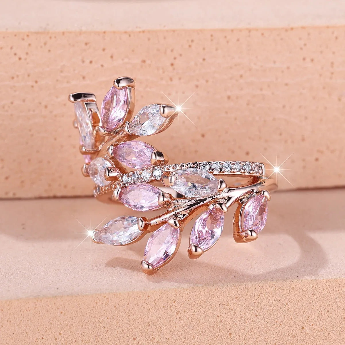 Adjustable copper leaf ring with zircon stones in multiple colour options including sapphire blue and white diamond