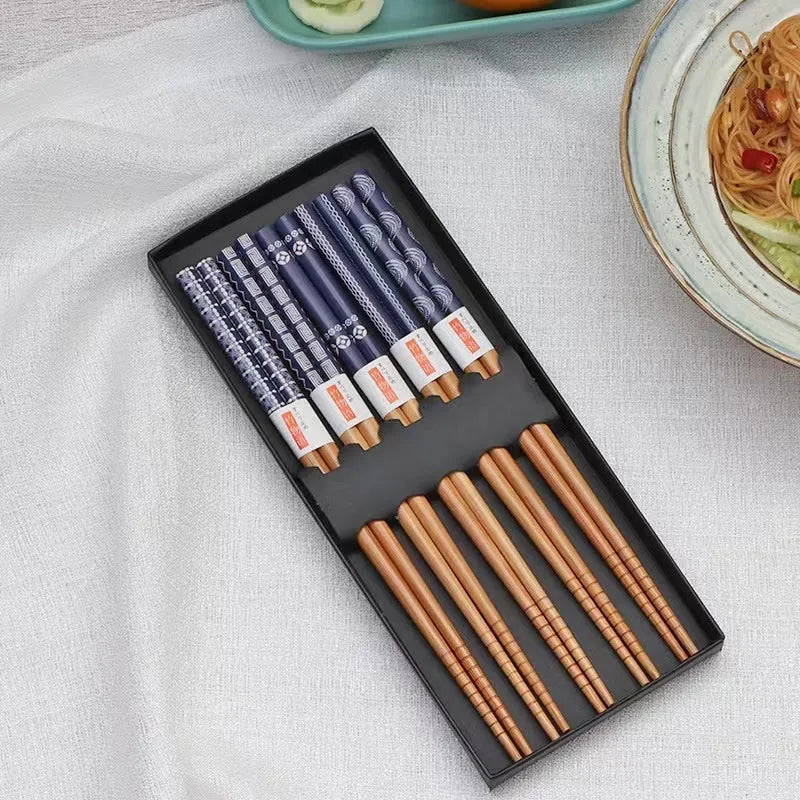 Set of five pairs of bamboo chopsticks with Japanese lucky cat pattern in a gift box.