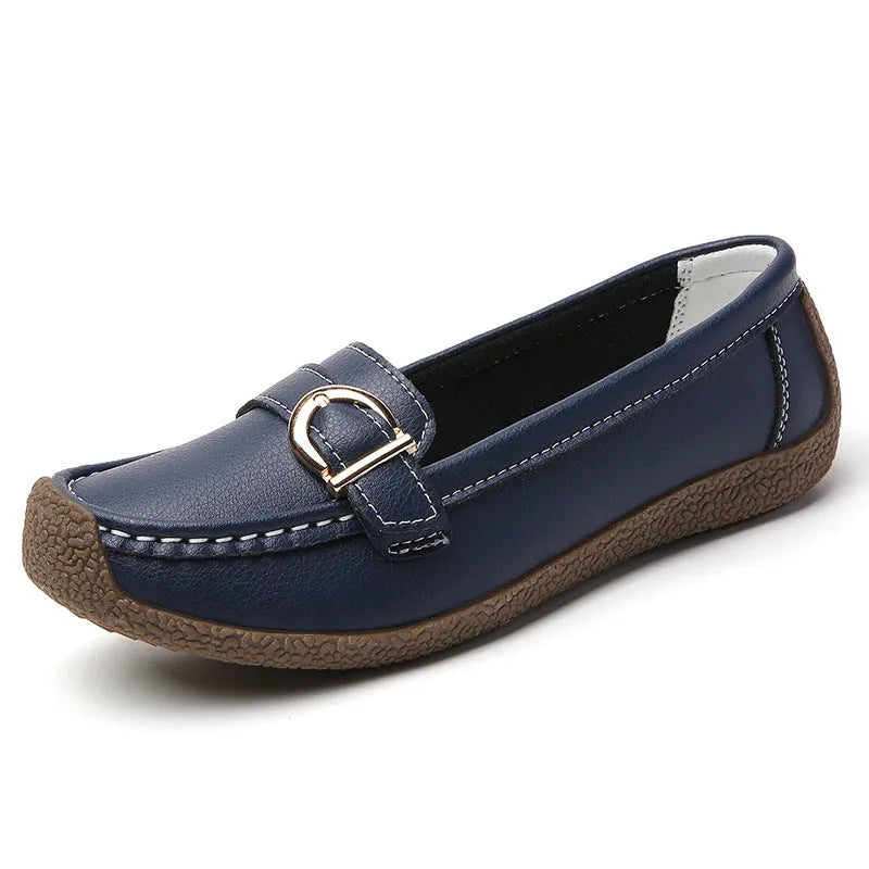 Women's casual loafers in beige with round toe, flat heel, and shallow cut opening.