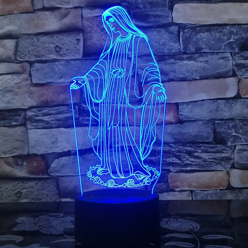 3D LED night light showing colourful dual ring pattern on acrylic panel, with remote control on desk.