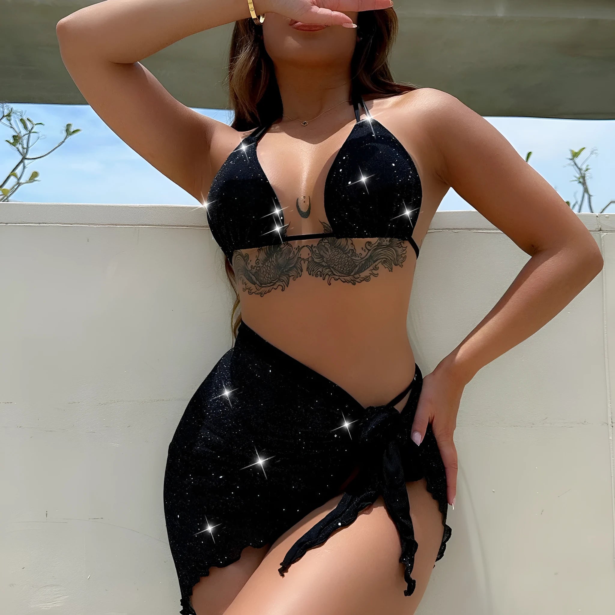 Black three-piece bikini swimsuit set with matching top and shorts