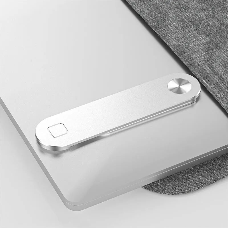 Aluminium laptop phone holder with magnetic clip mounted on laptop edge holding smartphone