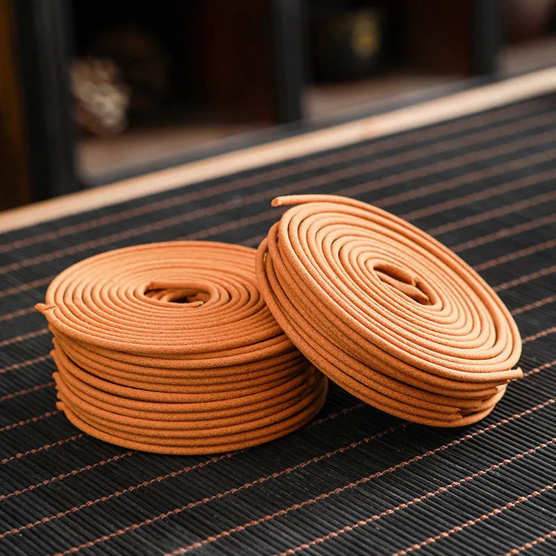 40 small half-handmade incense coils in a chosen fragrance such as sandalwood or agarwood for household use