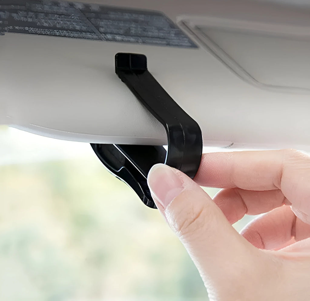 Black plastic car sun visor clip organiser for glasses, tickets and ID cards measuring 6.5 by 2.3 centimetres