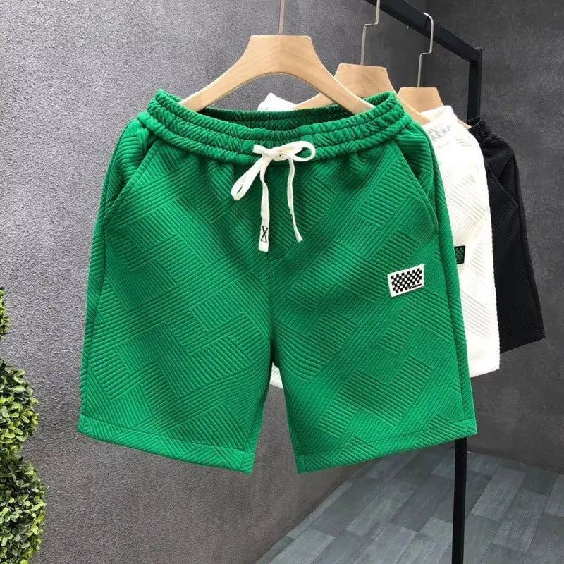 Casual polyester sports shorts with micro-elastic stretch in white, black, or green colours