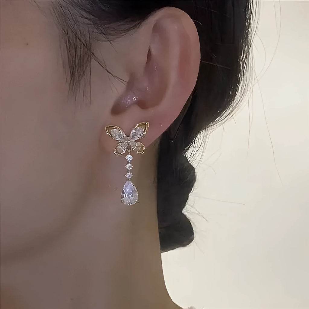 Platinum bow-shaped stud earrings with zinc alloy electroplated construction