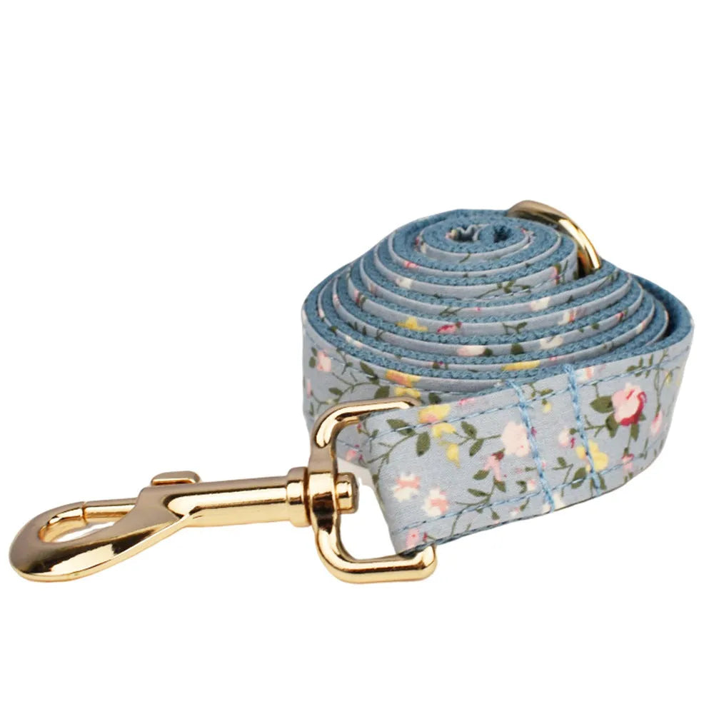 Blue floral pattern dog collar set with adjustable sizing and multiple accessory pieces