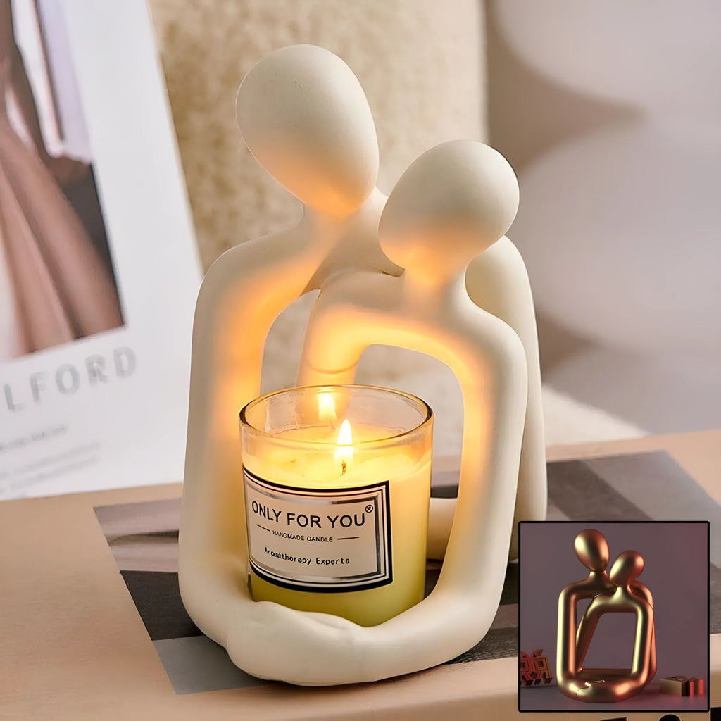 Modern white and gold resin couple statue for shelf or desk decor.