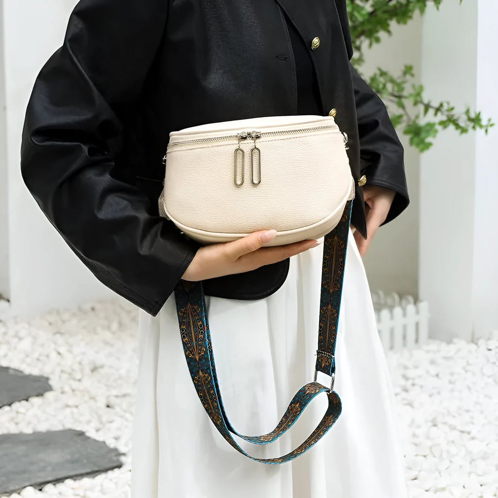 Women's saddle-shaped PU leather messenger bag in black with crossbody strap