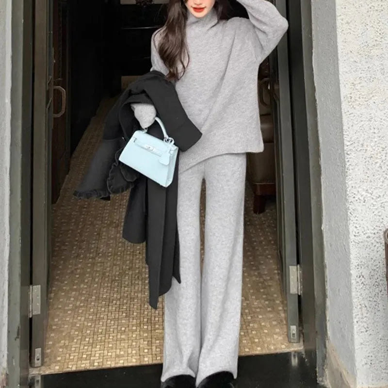 Women's casual acrylic fibre sweater and wide leg pants two-piece set in a solid colour.