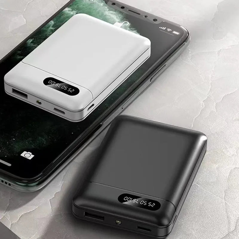 Black and white portable power bank charger with multiple USB ports and compact rectangular design