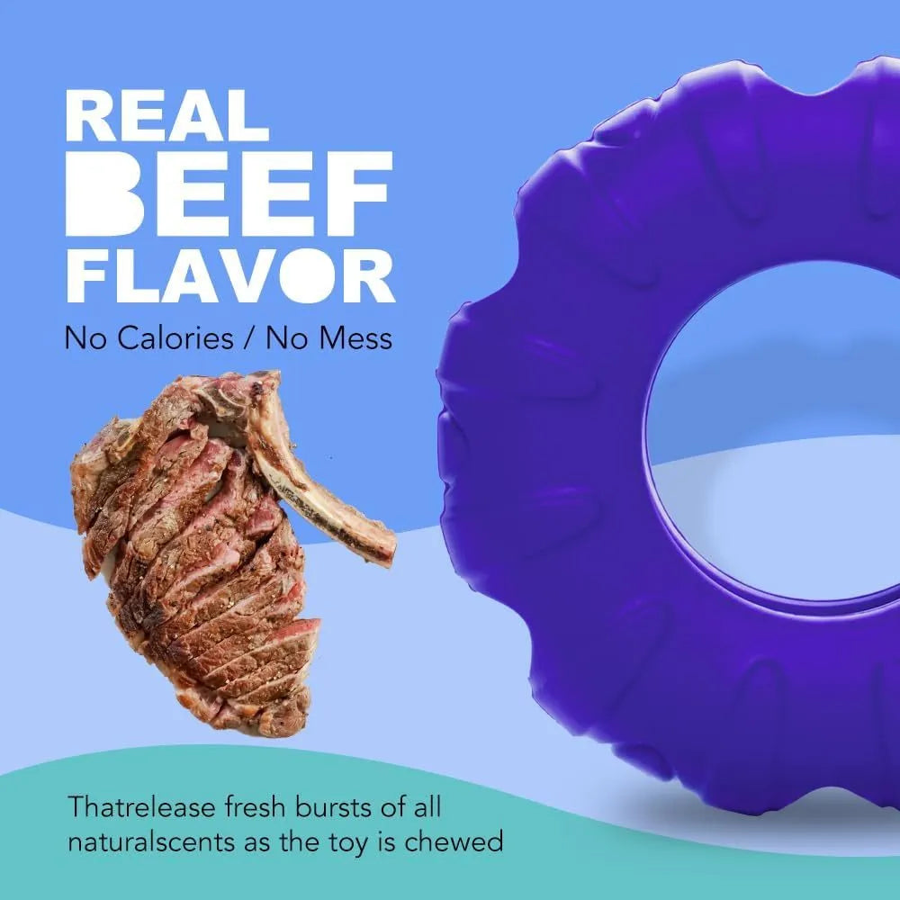 Blue rubber tyre-shaped dog chew toy with oval openings for treat dispensing
