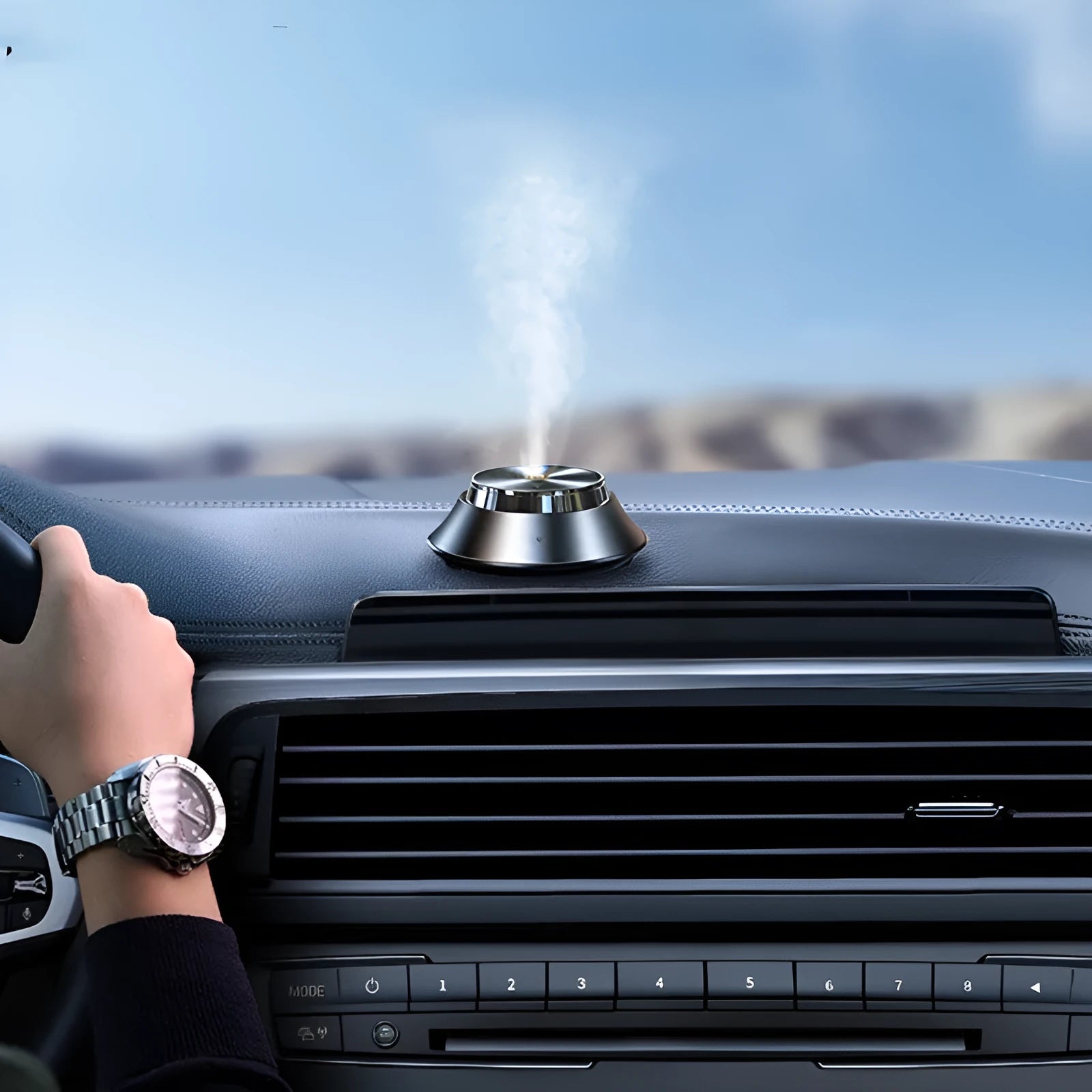 Black metal butterfly car aromatherapy air purifier with USB cable and essential oil bottle.