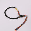Hand-woven obsidian carrying strap showing woven texture and adjustable 15.5-16cm length