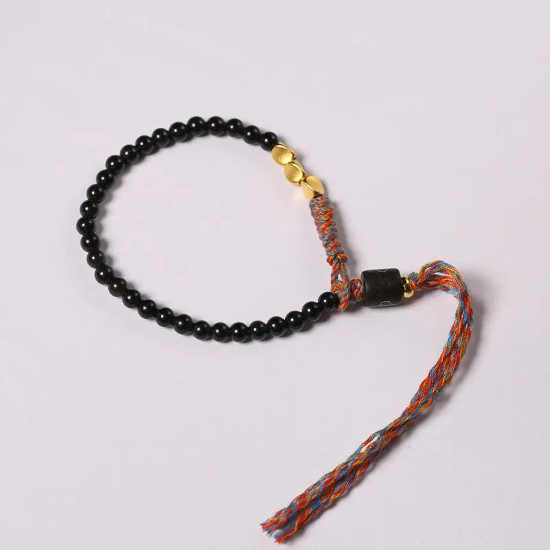 Hand-woven obsidian carrying strap showing woven texture and adjustable 15.5-16cm length