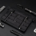 Solid black Oxford cloth portable organiser bag measuring 18cm by 3.5cm.