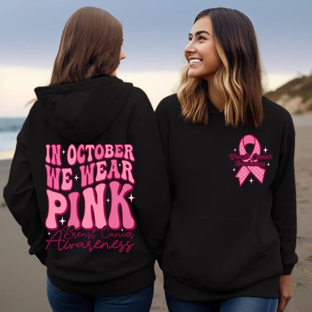 Breast cancer awareness pullover hoodie in pink with retro art design and a side seam pocket.