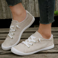 Women's creamy-white fabric casual sneakers with low-top design and rubber soles