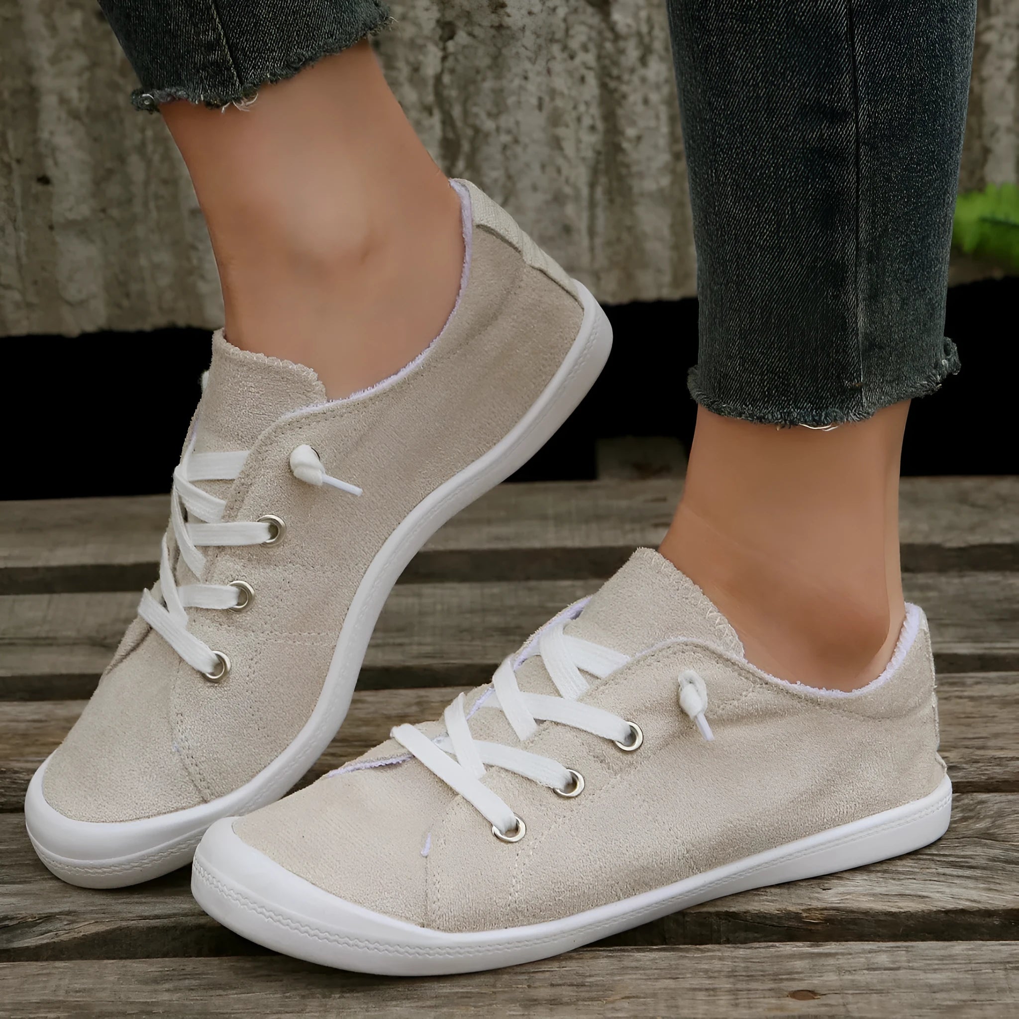 Women's creamy-white fabric casual sneakers with low-top design and rubber soles
