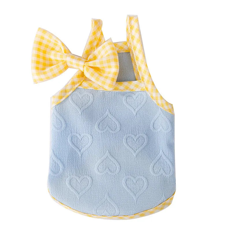 Small dog wearing heart bow vest with elastic suspenders in Bondi Blue colour