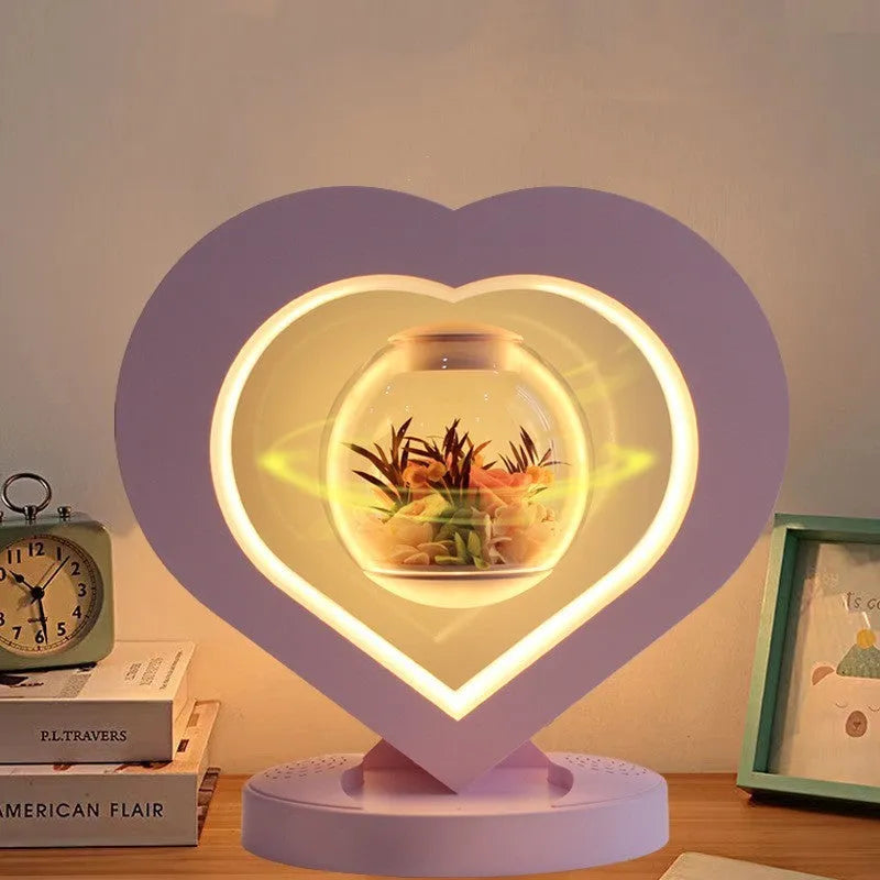 Pink preserved rose inside clear acrylic heart ornament with optional Bluetooth speaker base