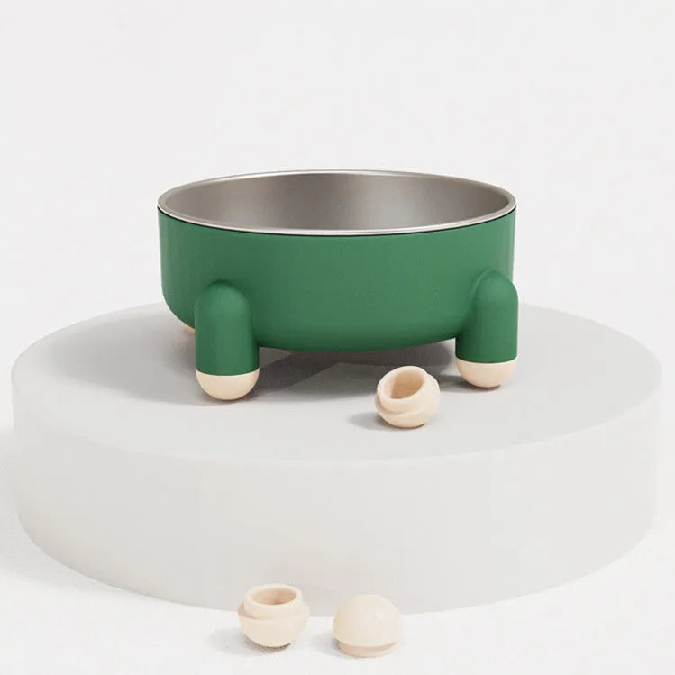 Green stainless steel pet bowl with high foot and non-slip base on a floor