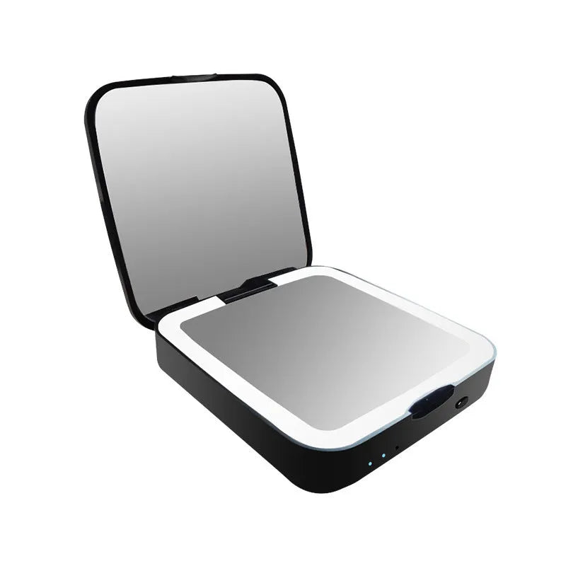 Black and white lighted vanity makeup mirror showing dual-sided design with magnification and adjustable colour temperature dial.