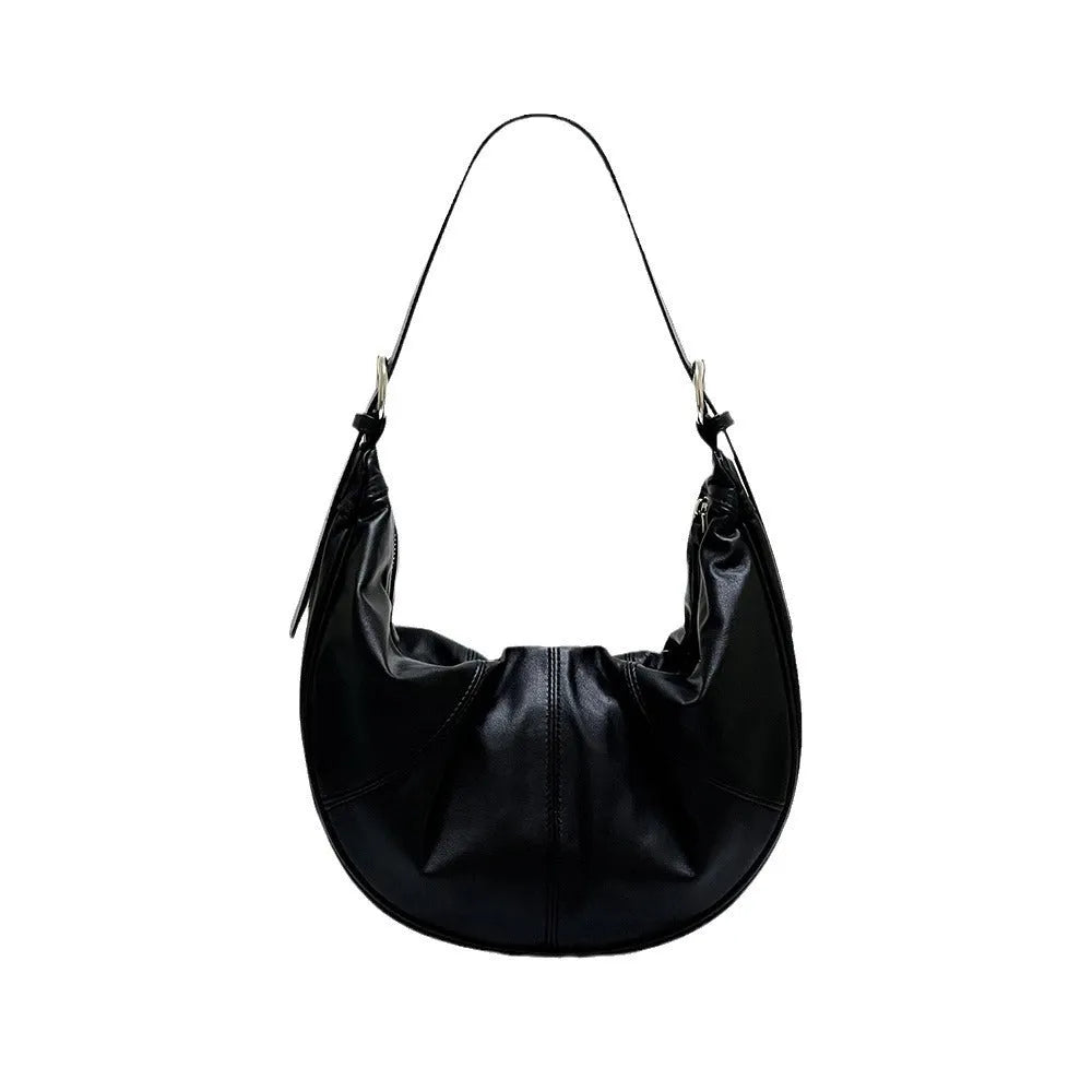Women's soft cowhide leather dumpling-shaped shoulder bag in silver colour with double straps.