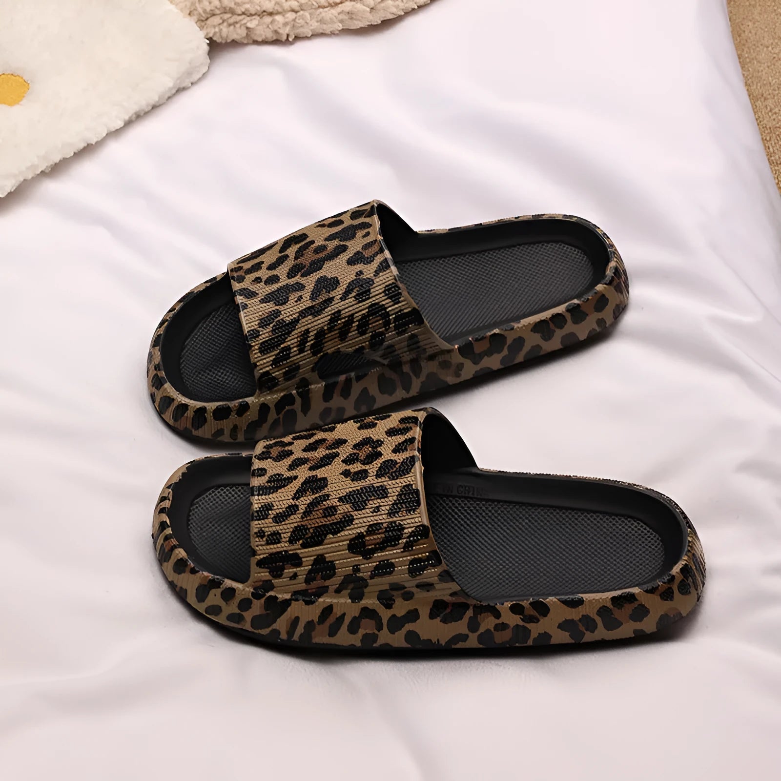 Women's leopard print EVA slippers shown in multiple colours and size options for indoor and outdoor wear.