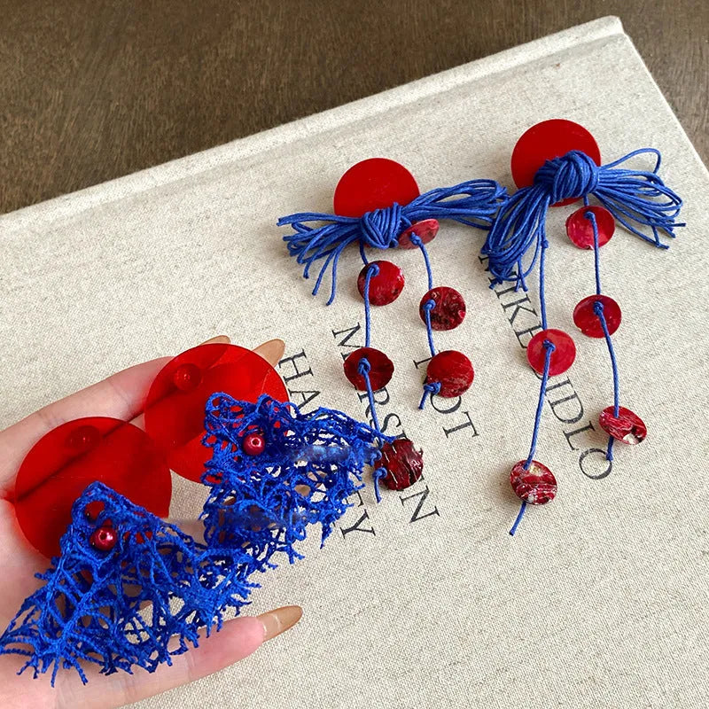 Geometric cloth women's earrings in 30 Silver Needle colour with blue resin flower detailing