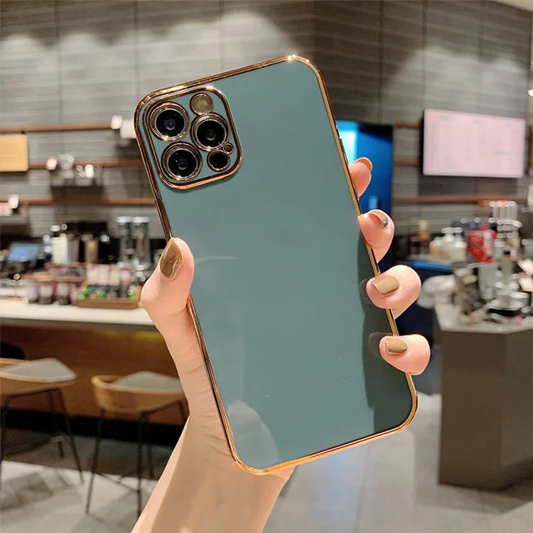 Gold plated iPhone case with silicone stripes on a TPU base for iPhone 11 and 12 Pro Max models.