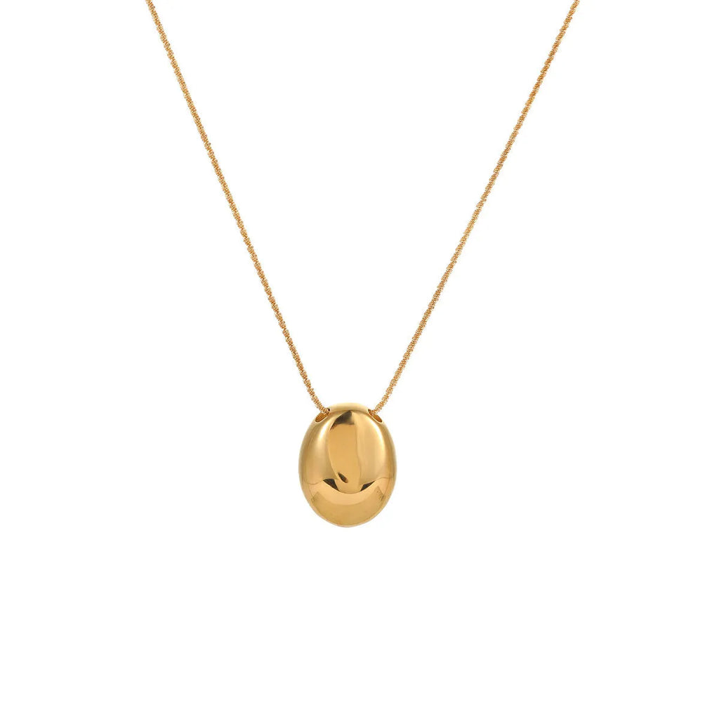Gold-plated geometric pendant long necklace with adjustable chain on dark background