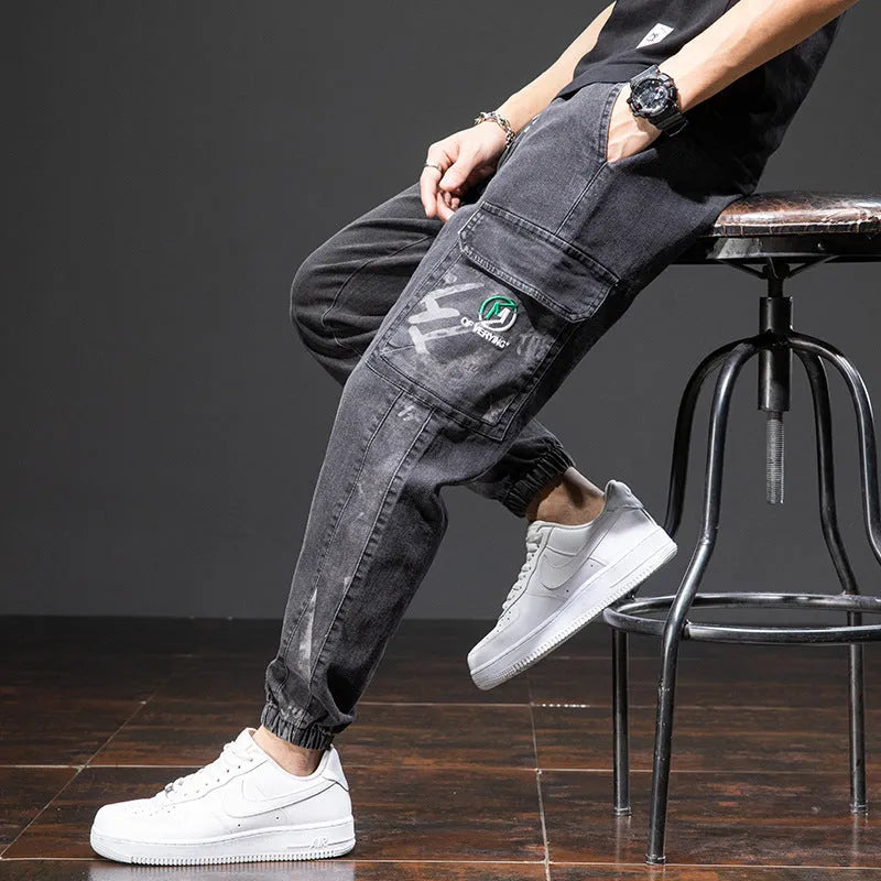 Men's loose fit cargo jeans in blue with straight leg and front pockets.