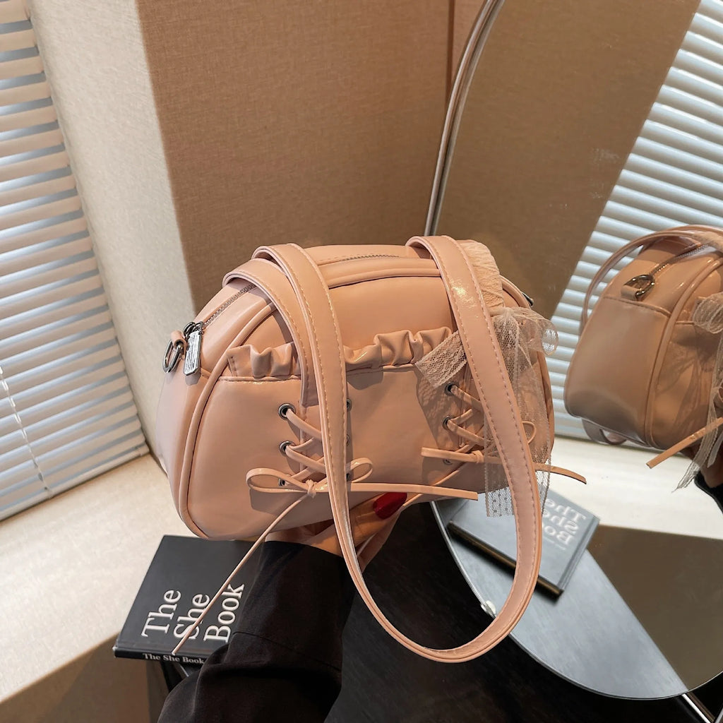 Women's bandage bow handbag in milky white colour with adjustable bow detail and internal mobile phone compartment