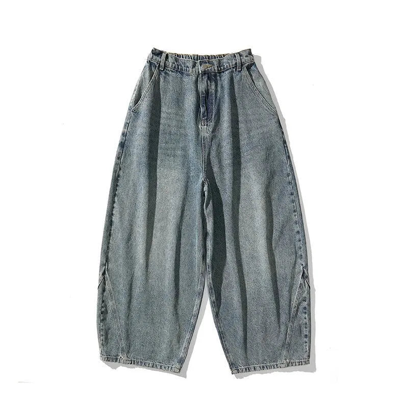 Men's loose fit plus size jeans in dark blue denim showing wide leg and low waist style.