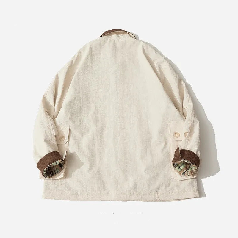 Green casual jacket with contrast trim and side seam pockets on a hanger