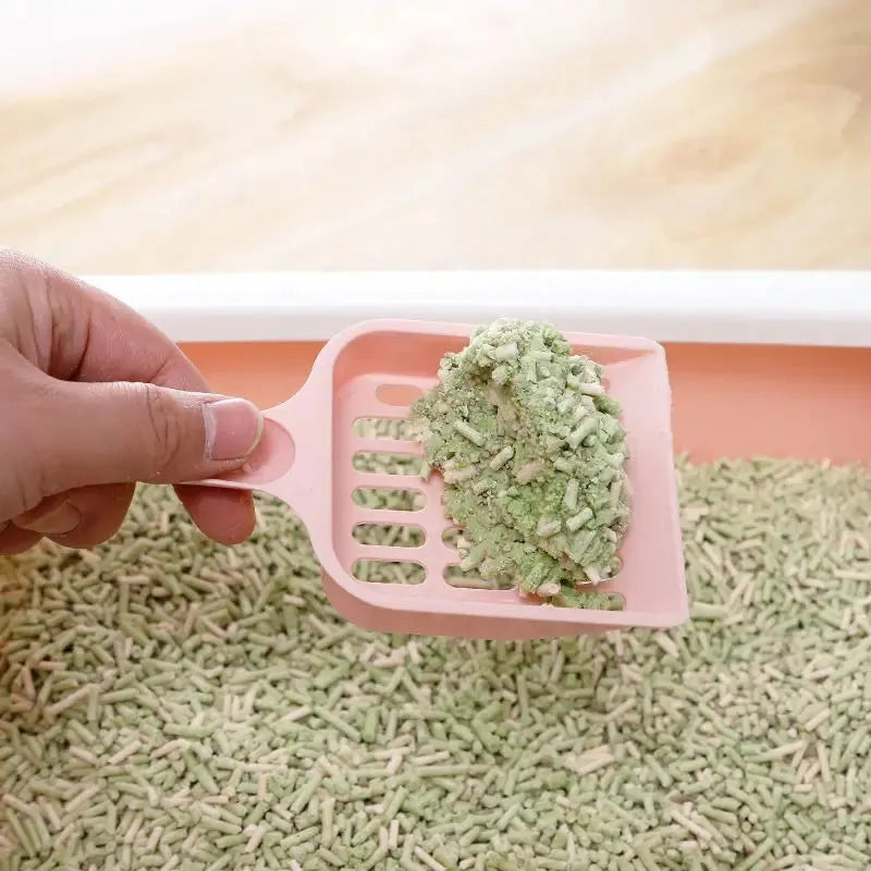 Blue plastic cat litter scoop with slotted design measuring 20cm long for litter box cleaning