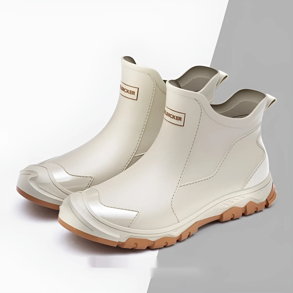 Short tube PVC rain boots with round toe and non-slip sole, shown in black and beige colour options.