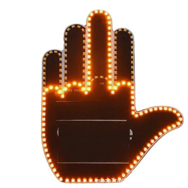 Black plastic LED gesture car light with remote control showing illuminated hand symbol.
