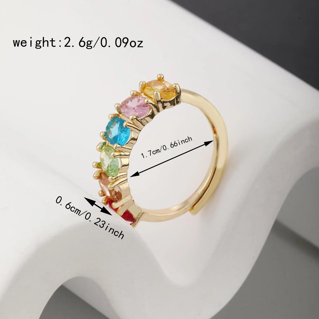 Gold-colour adjustable zircon ring with a simple retro design on a copper band.