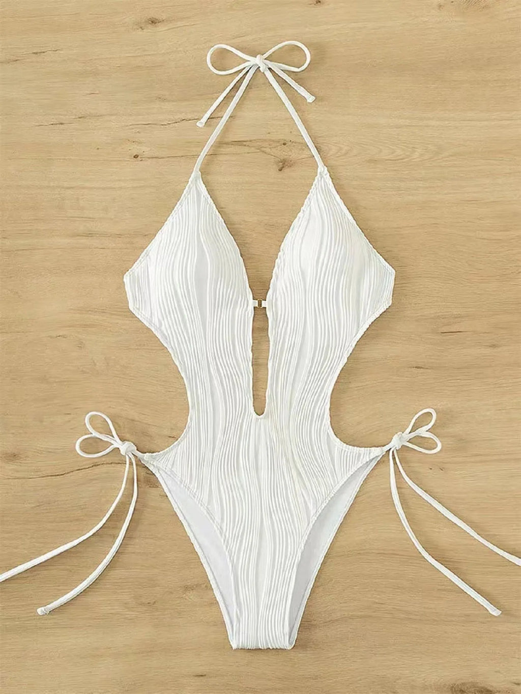 Women's black lace-up triangle bikini made from quick-dry polyester fabric.
