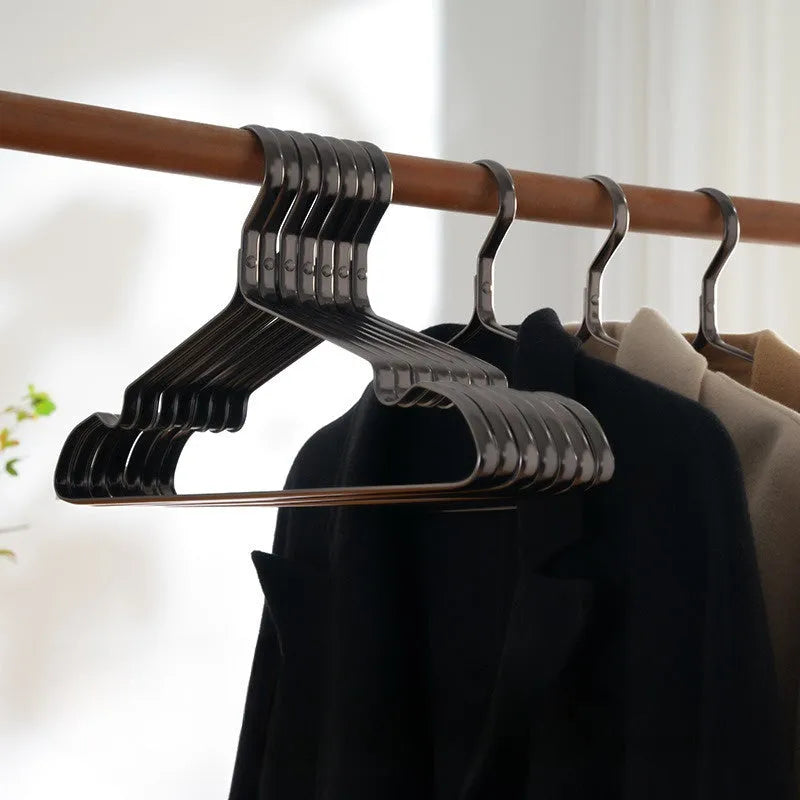 Elegant black non-slip anti-rust clothes hanger on a white background.