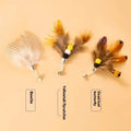 Three steel wire cat toy replacement heads with small flying insect designs and scratch-resistant coating