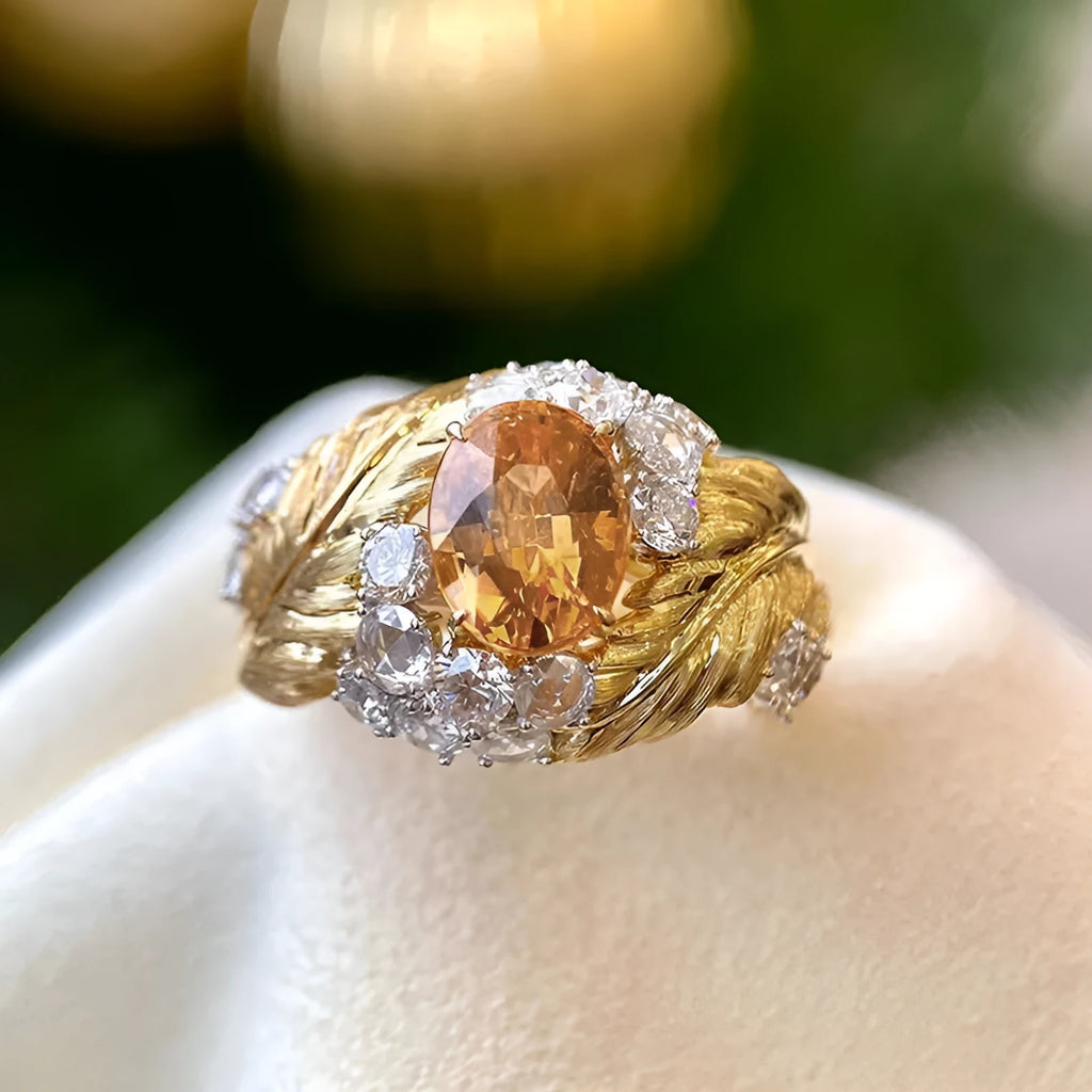 Gold-colour copper women's ring with embossed feather design and inlaid yellow zircon stone