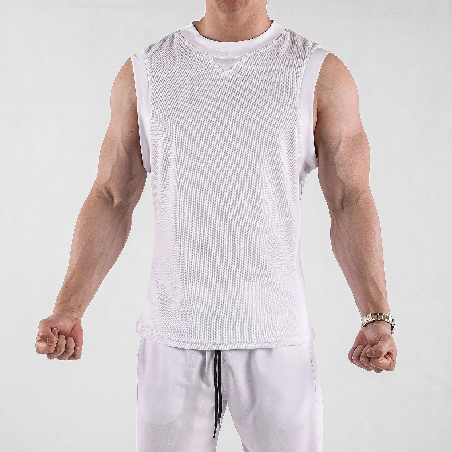 Men's loose-fit polyester sports vest in white or black, showing quick-dry stretch fabric for summer workouts