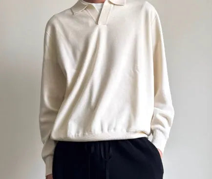 Man wearing a milky white pure wool lapel collar polo sweater with loose fit