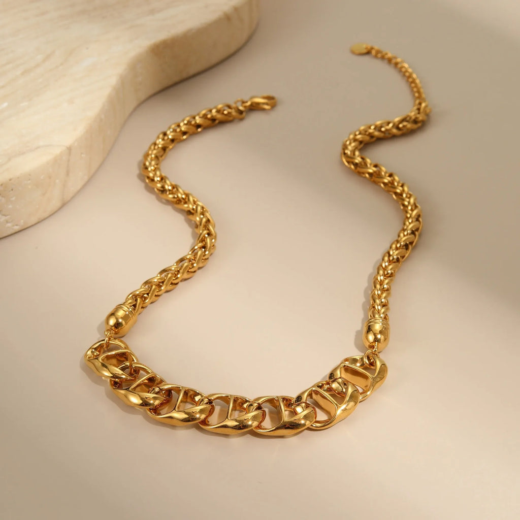 Gold plated stainless steel necklace with geometric pendant on regular chain