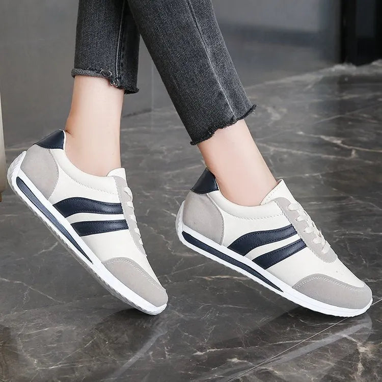 Blue low-top lace-up casual sneaker with PU mesh upper and flat rubber sole