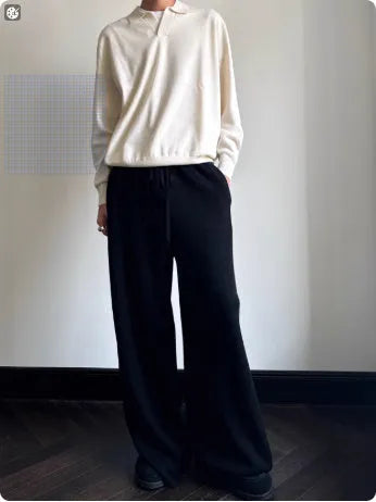 Man wearing a milky white pure wool lapel collar polo sweater with loose fit